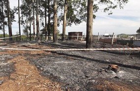 Bombeiros localizam caixão e ossada humana durante incêndio